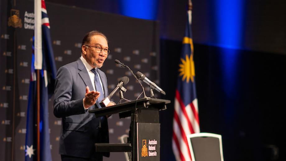 Photo of Prime Minister of Malaysia, the Honourable Dato’ Seri Anwar Ibrahim speaking on a lectern